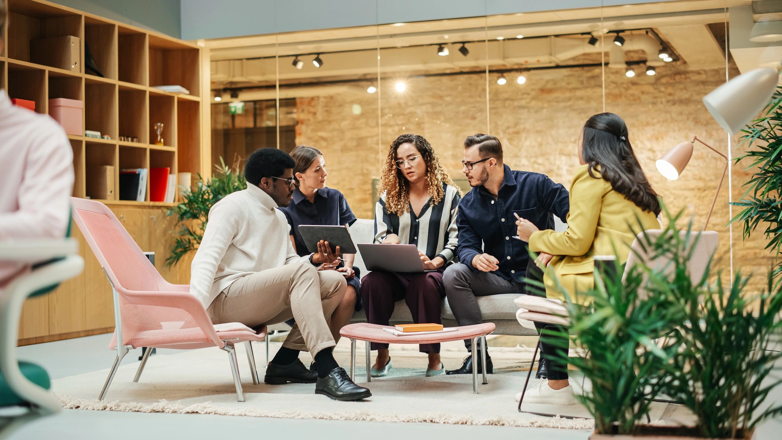 Business team collaborating on digital strategy in a meeting room